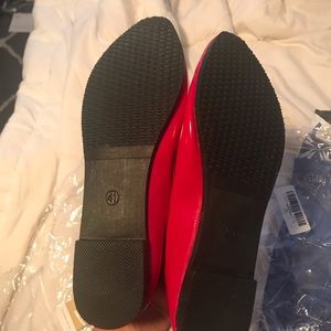 Brand new red flats. Never been worn.